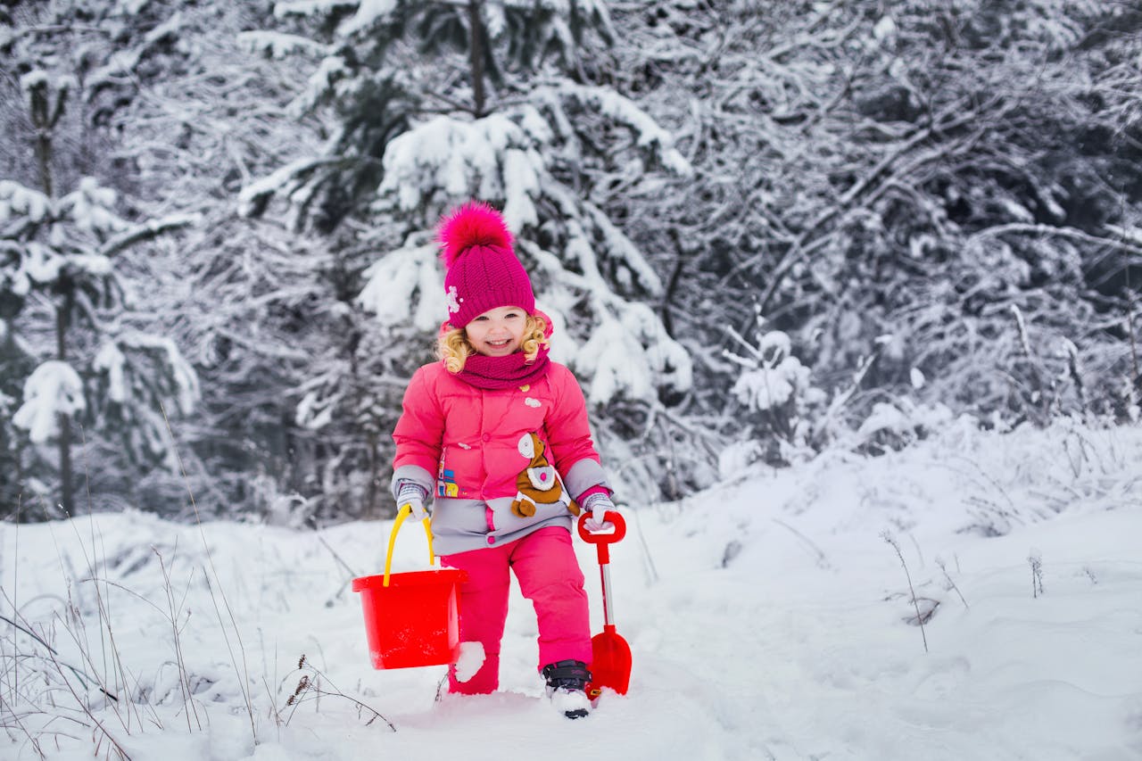 A kid shoveling snow